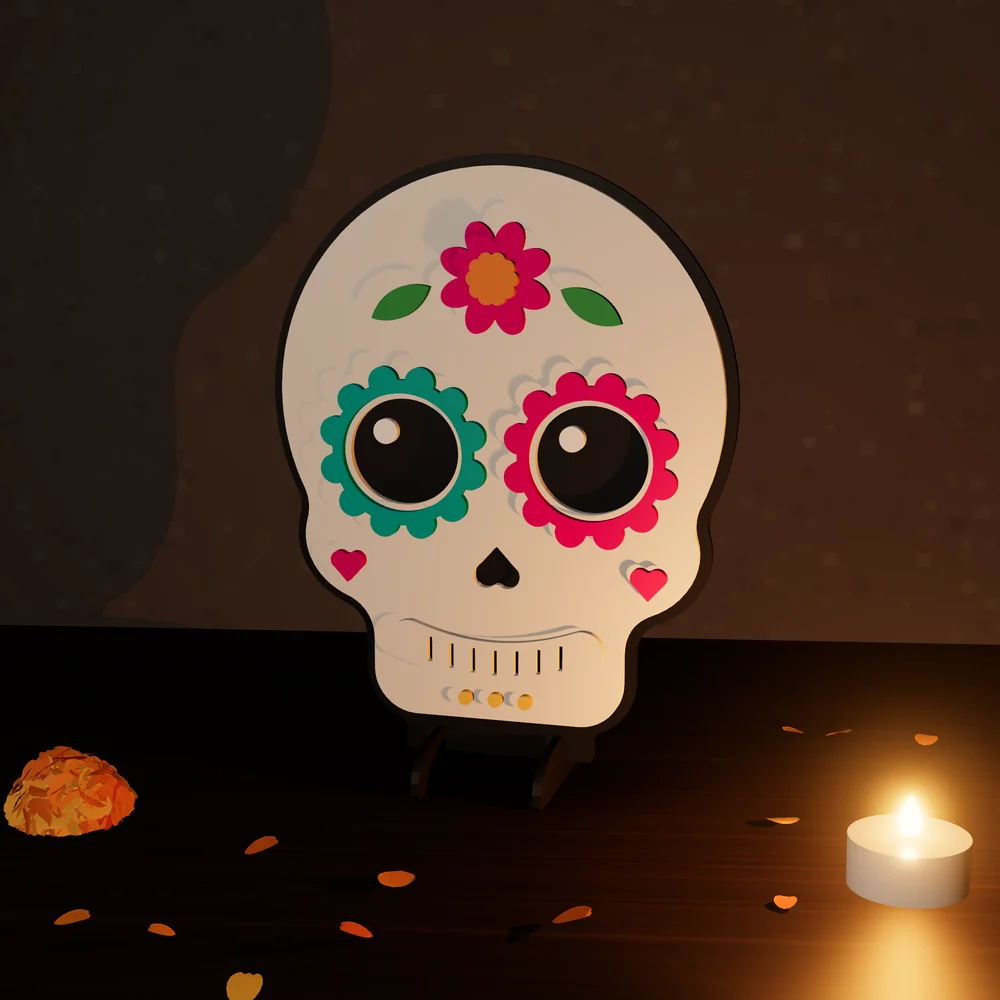 Calaverita de azúcar: figura de MDF en 4 capas pintadas, parada en su base junto a una vela y pétalos de cempasúchil.