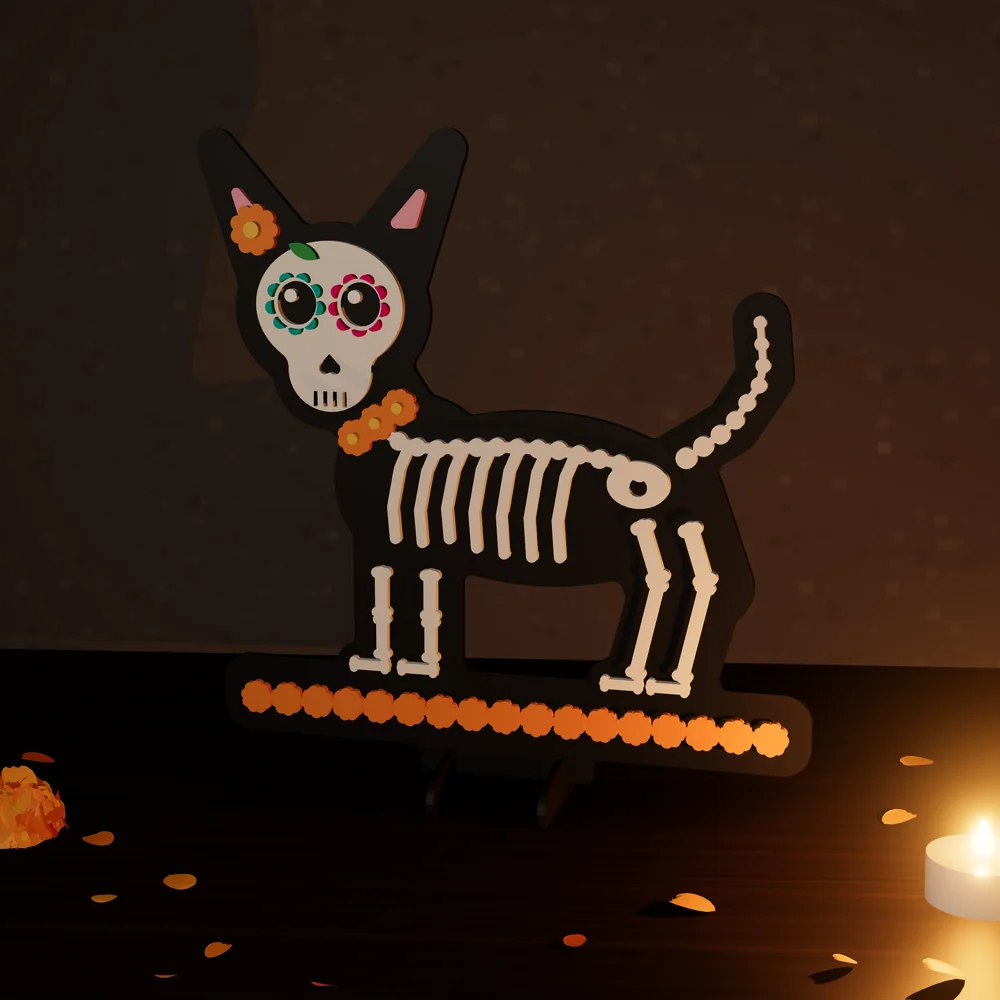 Perrito calavera: figura de MDF en 4 capas pintadas, parada en su base junto a una vela y pétalos de cempasúchil.